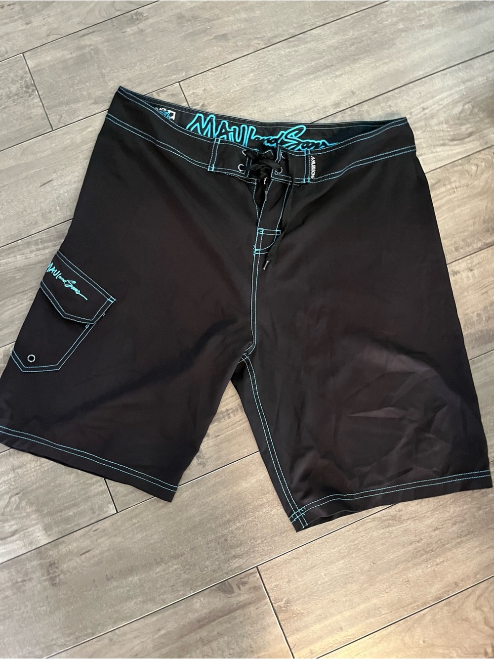 Maui and Sons Black Board Shorts with Teal Stitching